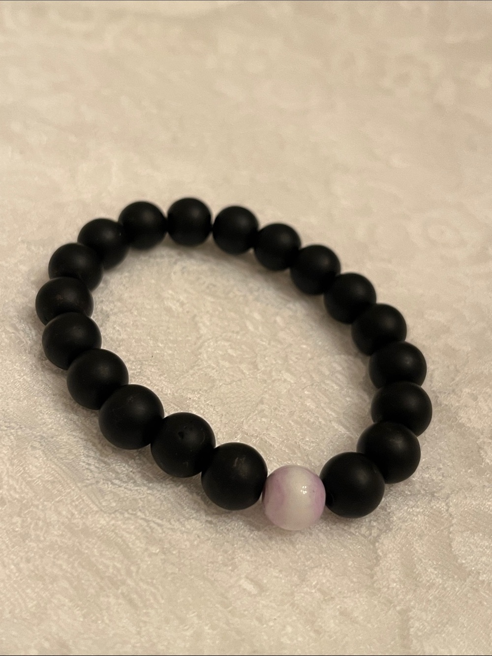 Matte Black Beaded Bracelet with Accent Pink-White Bead
